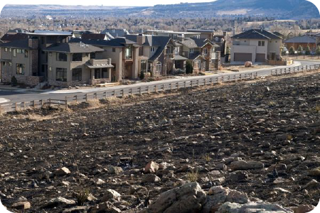 Apartment complexes next to a hill