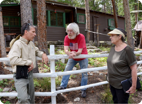 Wildfire Partners staff talking to two Boulder County residents