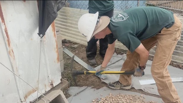 CBS Wildfire Mitigation Teens helping with wildfire mitigation at a mobile home