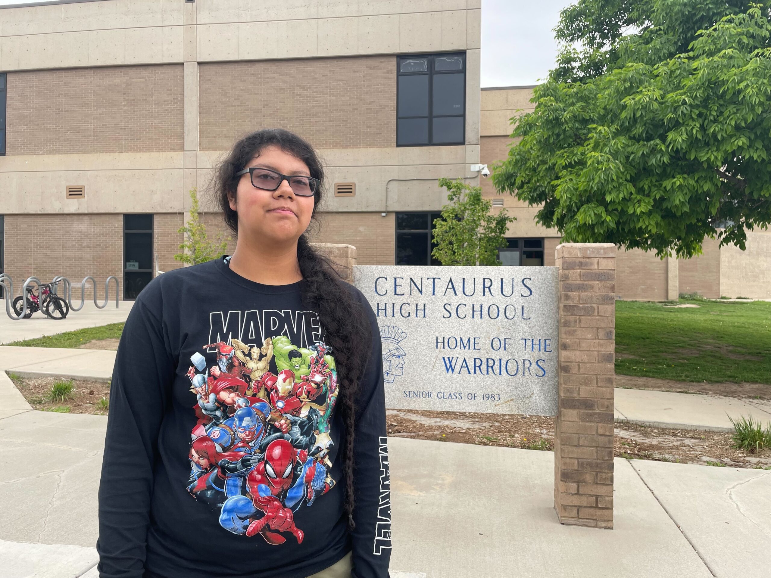 Melanie Flores standing in front of Centaurus High School