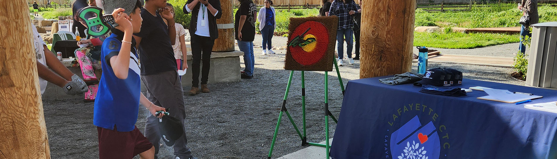 Boys playing plastic ax throwing game