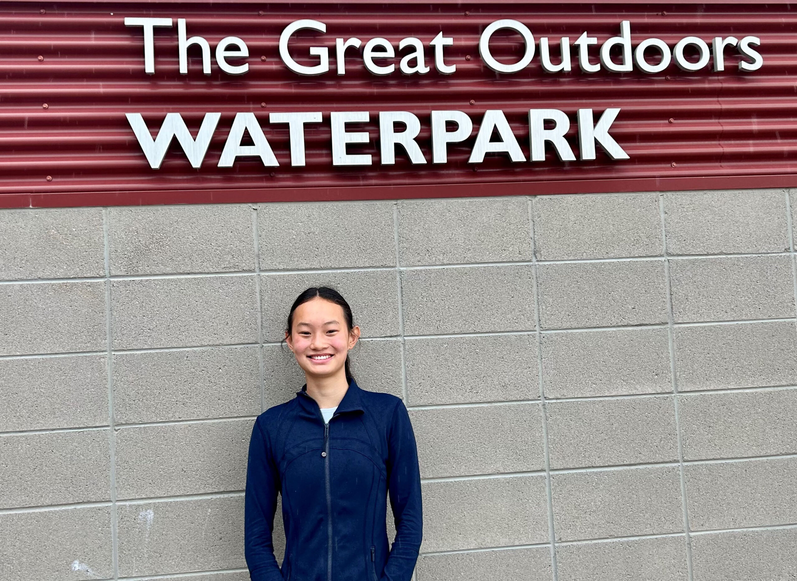 Skye Williams in front of the Great Outdoors Waterpark